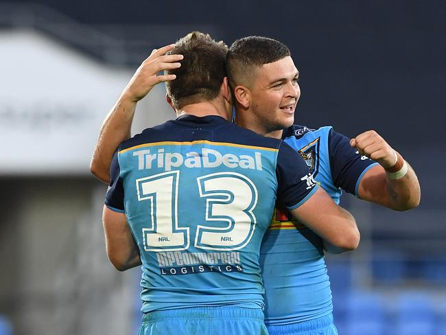 Jai Arrow and Ashley Taylor (right) of the Titans react following the Round 11 NRL match between the Gold Coast Titans and the Newcastle Knights at CBUS Super Stadium at Robina on the Gold Coast, Saturday, May 19, 2018. (AAP Image/Dave Hunt) NO ARCHIVING, EDITORIAL USE ONLY