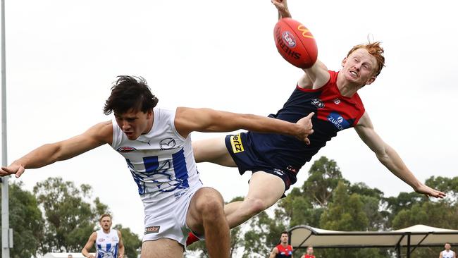 Melbourne’s Jake Bowey spoils North’s Eddie Ford in a pre-season match at Casey Fields in February 2022. Picture: Michael Klein