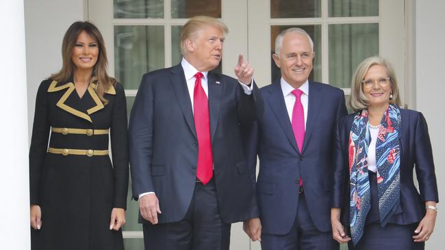 President Donald Trump first lady Melania Trump, far left, with Australian Prime Minister Malcolm Turnbull and his wife Lucy Turnbull, far right, stop to look at the Rose Garden at the White House in Washington, Friday, Feb. 23, 2018. (AP Photo/Pablo Martinez Monsivais)