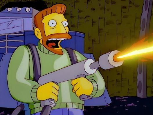 Hank Scorpio makes use of his flamethrower in The Simpsons.