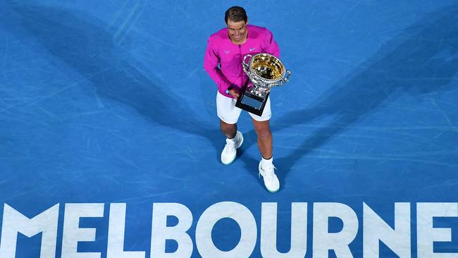 Rafael Nadal poses with the trophy after winning the mens’ singles Australian Open title in January this year. Picture: AFP