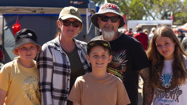 Peter, Natasha, Summer, Jasmin and Jonas Vicery at the arts enjoy the market stalls at the Moore Park Beach Arts Festival.