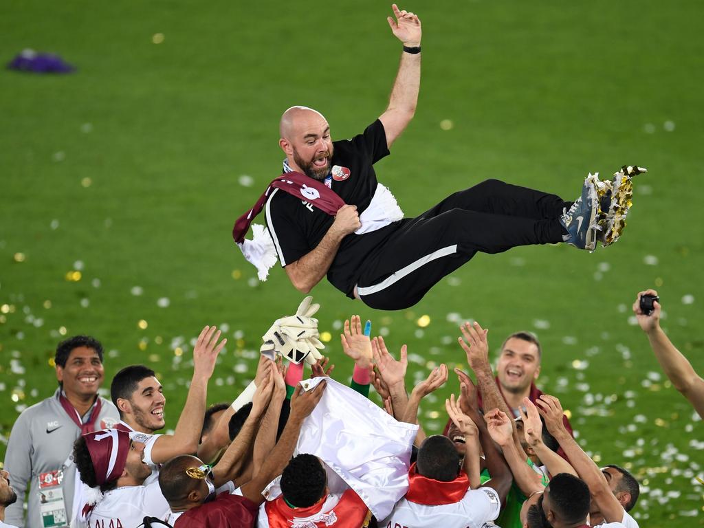 Qatar's coach Felix Sanchez is thrown in the air as his team celebrates their win in the 2019 AFC Asian Cup final. Picture: AFP
