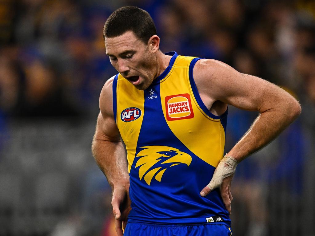 Jeremy McGovern winces after a face knock against Melbourne. Picture: Daniel Carson/AFL Photos via Getty Images