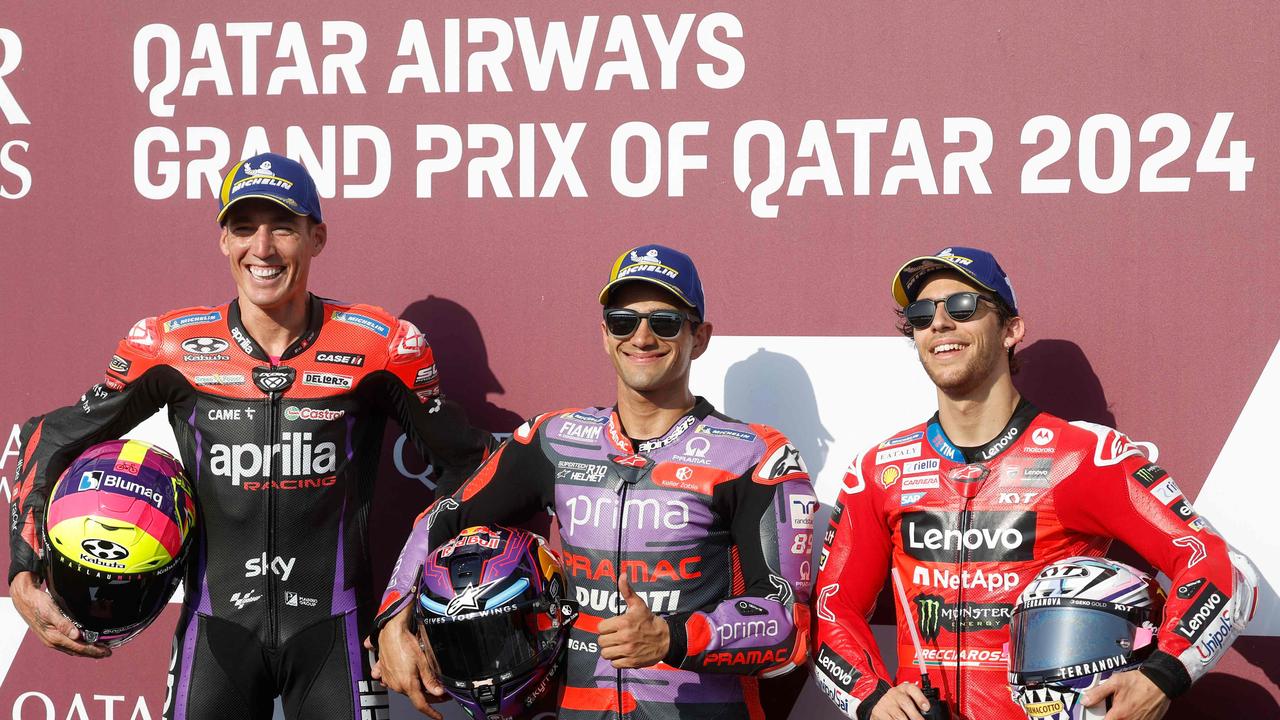 (L to R) GASGAS Factory Racing Tech3 Spanish rider Pol Espargaro, Prima Pramac Racing Spanish rider Jorge Martin and Ducati Lenovo Team Italian rider Enea Bastianini pose for a picture after their podium finish during the qualifying session of the Qatar MotoGP Grand Prix at the Lusail International Circuit in Lusail, north of Doha on March 9, 2024. (Photo by KARIM JAAFAR / AFP)