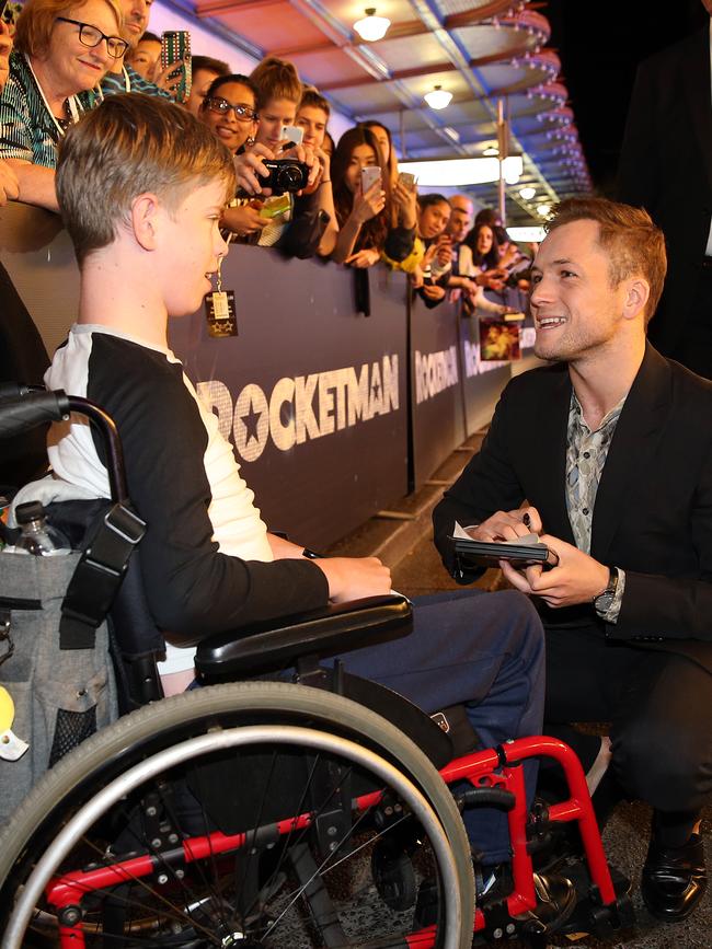 Egerton chats to fan Daniel Weaver on the red carpet of the premiere. Picture: Sam Ruttyn