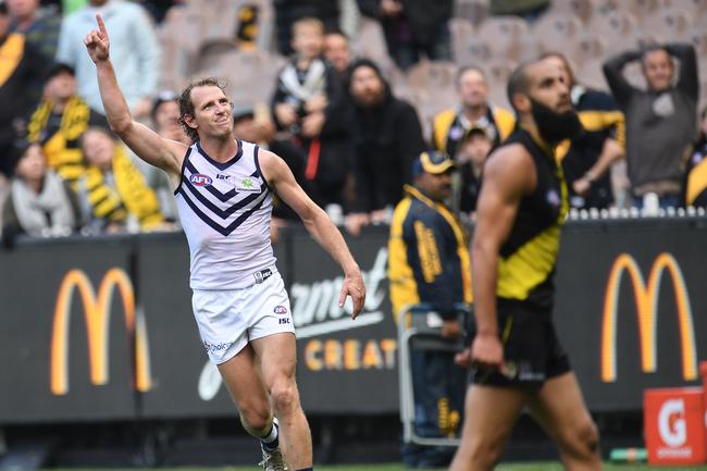 The bloke with his hands on his head sums up the mood perfectly as David Mundy wins the game after the siren in round eight. Picture: Julian Smith/AAP