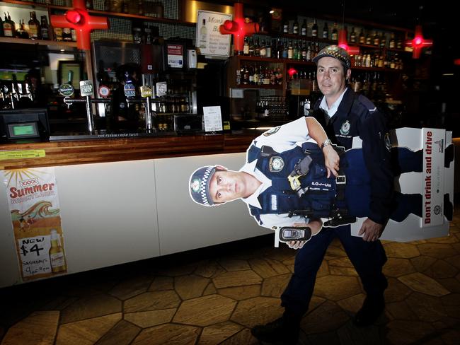 Better than the real thing? … Constable Chris Gilby with his cardboard likeness carrying the message “Don't drink and drive”.