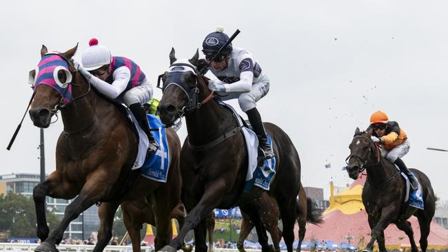 MELBOURNE, AUSTRALIA - FEBRUARY 08: Jye McNeil riding Rey Magnerio defeats Blake Shinn riding Insurrection in Race 6, the Herald Sun Rubiton Stakes during Melbourne Racing at Caulfield Racecourse on February 08, 2025 in Melbourne, Australia. (Photo by Vince Caligiuri/Getty Images)