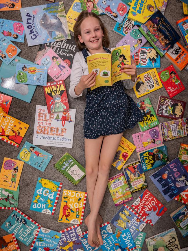 Macy Jeffrey, 8, loves books and has been known to read under her doona cover when she should be asleep. Picture: Tony Gough