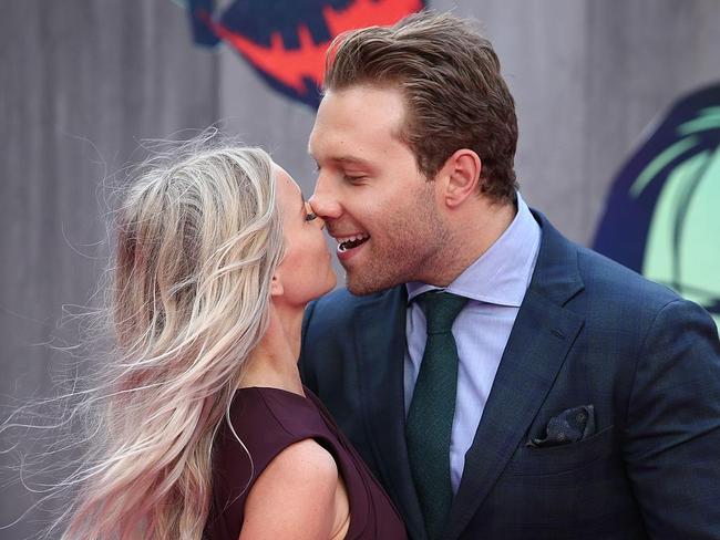 Jai Courtney kisses Mecki Dent at the European Premiere of “Suicide Squad” at the Odeon Leicester Square on August 3, 2016 in London, England. Picture: AFP