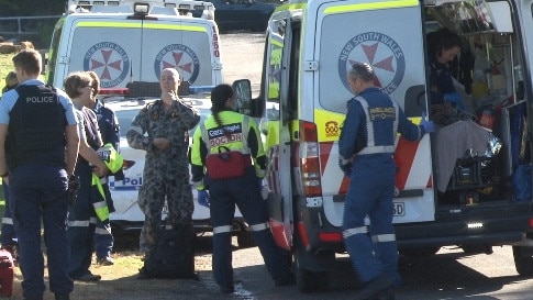 The navy diver in the rear of an ambulance before he is placed aboard the CareFlight Rescue helicopter at Porter Reserve, Newport, for the flight to Prince of Wales Hospital at Randwick. Picture: TNV