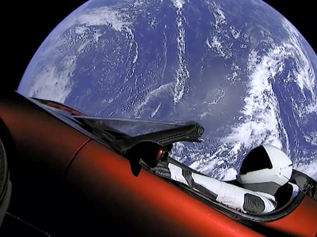 This image from video provided by SpaceX shows the company's spacesuit in Elon Musk's red Tesla sports car which was launched into space during the first test flight of the Falcon Heavy rocket on Tuesday, Feb. 6, 2018. (SpaceX via AP)