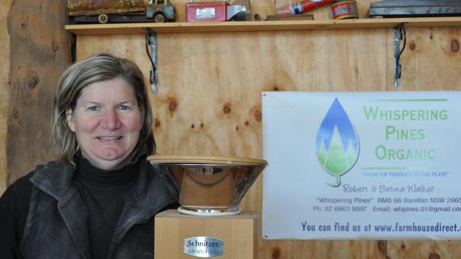 Betina Walker of Whispering Pines Organics at Barellan in NSW with the family’s first flour mill. Picture: Lindsay Hayes