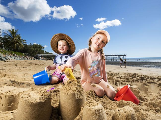 Siblings Mason, 2, and Zara King, 5, from Greenslopes, enjoy some time on the beach at Scarness while on their family holiday at Hervey Bay. Picture: Lachie Millard