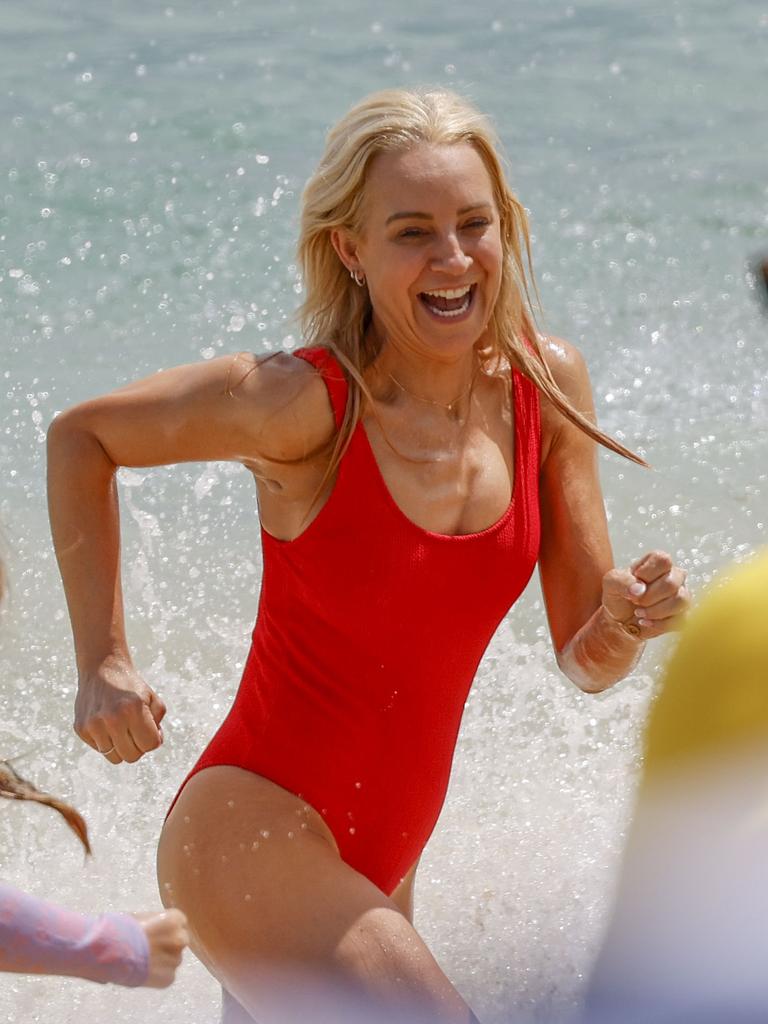 Carrie Bickmore, 44, was seen frolicking in the surf. Picture: Media Mode