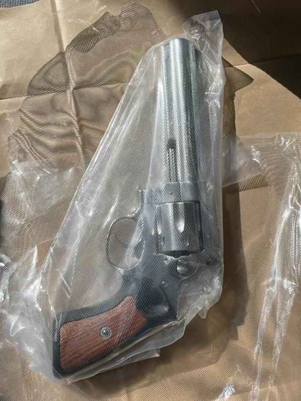 A handgun and box of ammunition were seized by police. Picture: SA Police