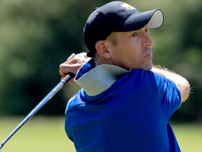 Hugh Bowman watches the flight of his ball during a round of golf at the Metropolitan Golf Club. Picture Jay Town