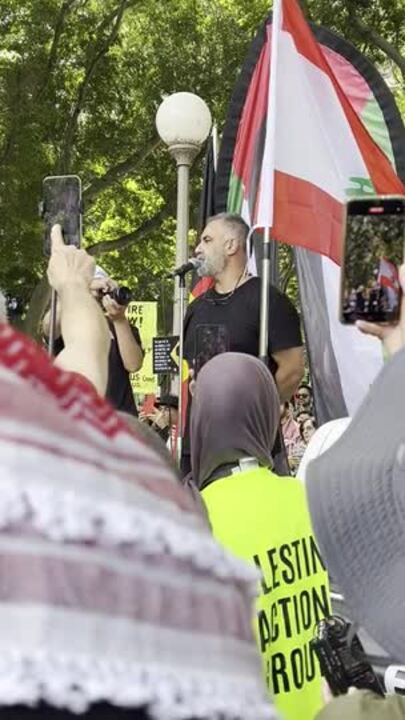 Southern Lebanese photographer Tom Toby addresses the rally