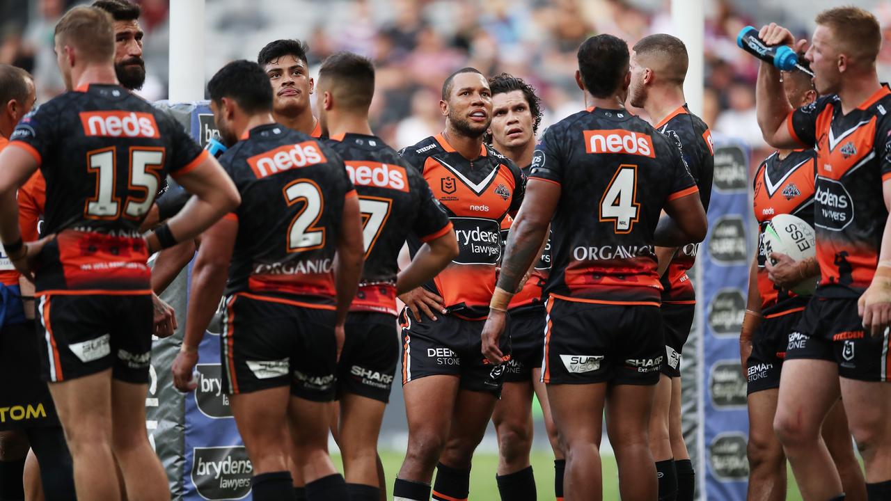 SYDNEY, AUSTRALIA - APRIL 25: Moses Mbye of the Tigers and teammates look dejected after a Sea Eagles try during the round seven NRL match between the Wests Tigers and the Manly Sea Eagles at Bankwest Stadium, on April 25, 2021, in Sydney, Australia. (Photo by Matt King/Getty Images)