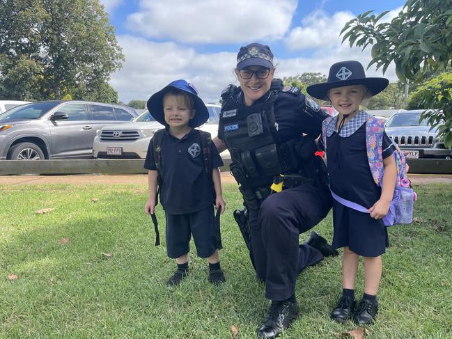 Darling Downs Highway Patrol Senior Sergeant Kim Hill with Middle Ridge State School students Lillian and Harvey Willis.