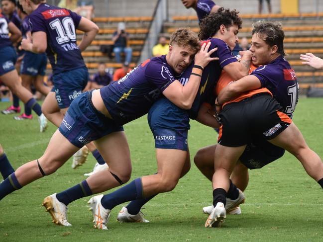 Cooper Rauhihi is hit hard by the Melbourne defence. Picture: Sean Teuma