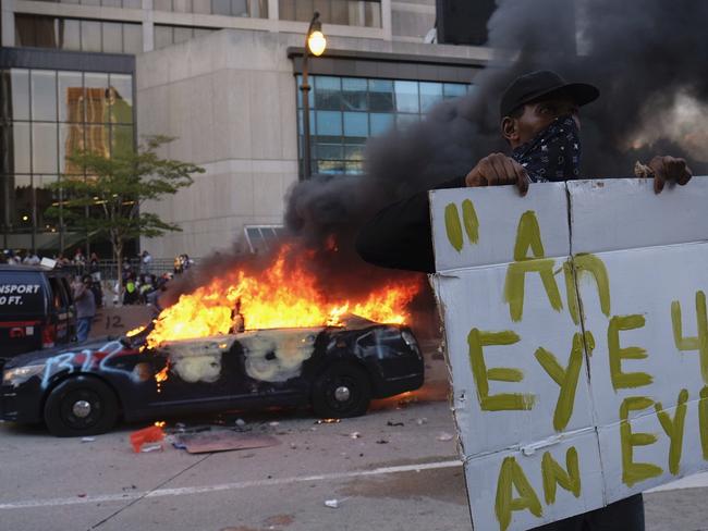 A police car burns during a protest in Atlanta. Picture: AP