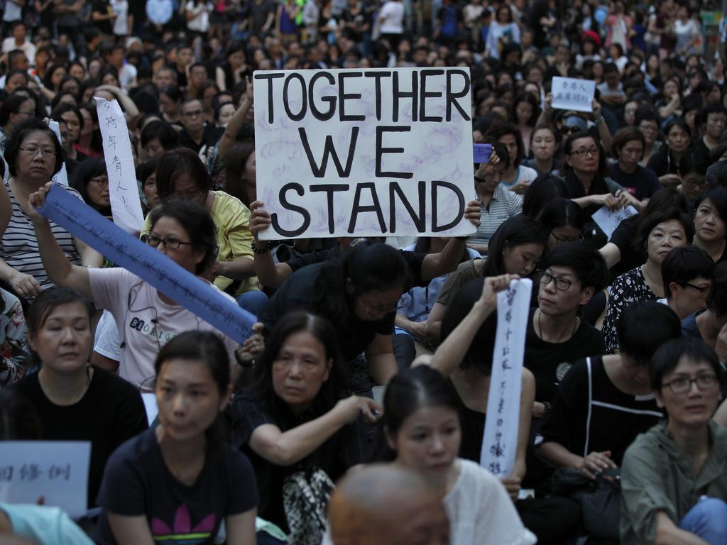 Thousands of mums rally by mothers in support of the student protesters, nicknamed the “death fighters” in Hong Kong on Friday. Picture: AP Photo/Andy Wong