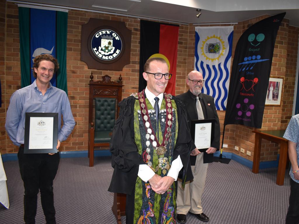 Calum Horn, Michael Merritt and Ben Cummings with mayor Isaac Smith after receiving their citizenship