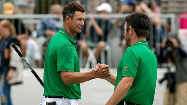 International team members Adam Scott and Louis Oosthuizen have turned up the heat. Picture: AFP