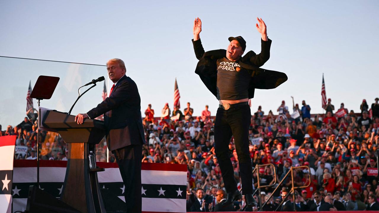 Elon Musk jumps on stage as he joins former US president Donald Trump during a campaign rally in Butler, Pennsylvania. Picture: Jim Watson/AFP