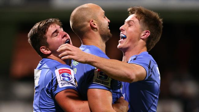 Billy Meakes celebrates a try with his Force teammates.