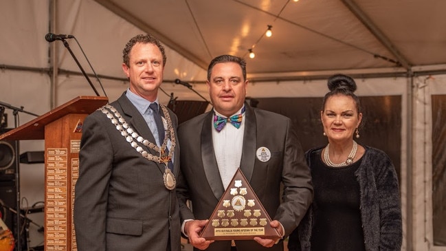 Toowoomba Apexian Jordan Martin's proud parents Craig and Chrissie Martin accept the Young Apexian of the Year Award on his behalf.