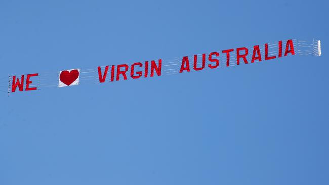 Virgin Australia sign being flown over Queenscliff. Picture: Glenn Ferguson