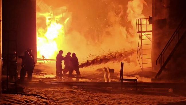Firefighters work to extinguish a fire at an oil depot in the Kursk region set ablaze by a night-time Ukrainian drone attack. Picture: Telegram/@gubernator_46/AFP