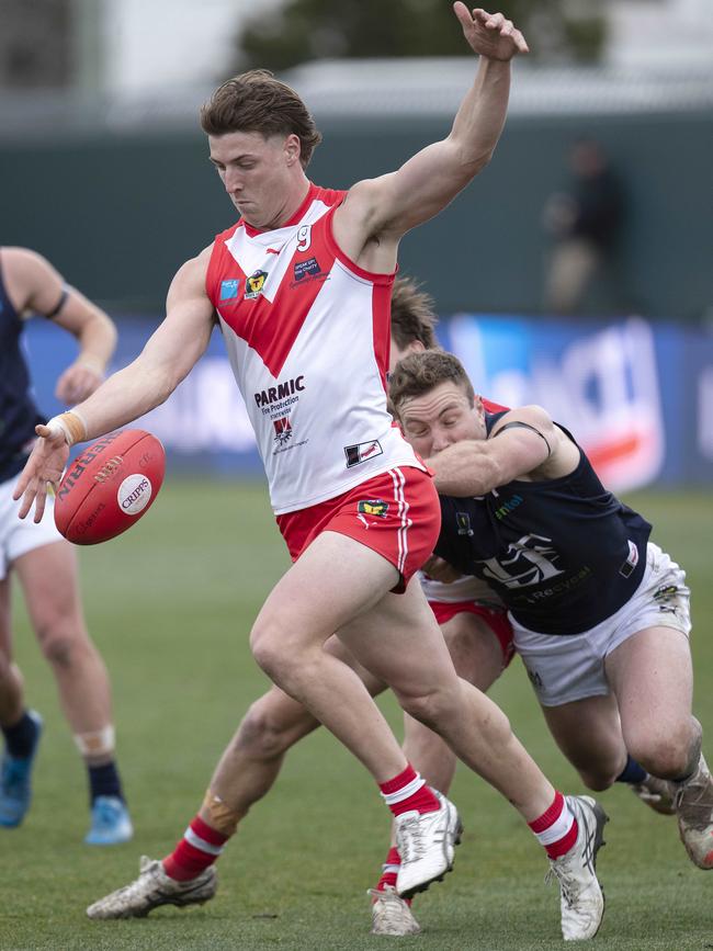 Clarence defender Zac Buechner clears trouble against Launceston at Blundstone Arena three weeks ago. Picture: Chris Kidd