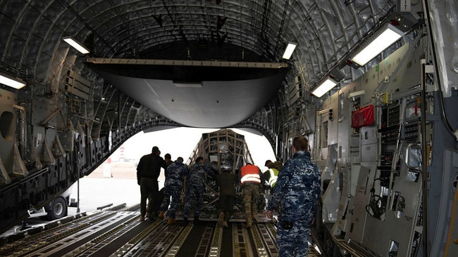 Military aid bound for Ukraine is unloaded from A RAAF C-17A Globemaster on Friday. Picture: Defence Department