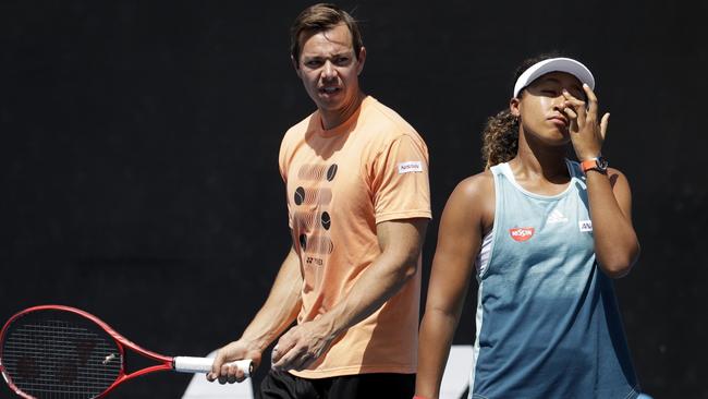 Sascha Bajin, coach of Japan's Naomi Osaka talks with her during a practice session