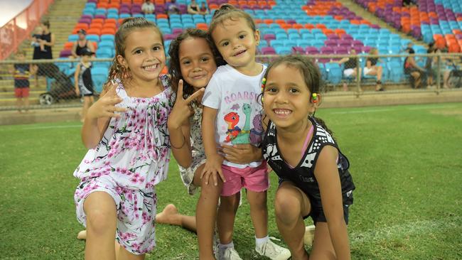 Gabby Davey (6), Harper Perry (7), Layla Davey (2) and Charley Davey were playing kick to kick before the Palmerston Magpies against St Mary's. Picture: (A)manda Parkinson