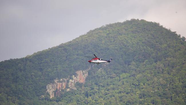 The Rescue 510 rescue helicopter assisting police on the Captain Cook Highway. Picture: PETER CARRUTHERS