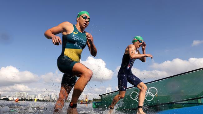 Australia’s Emma Jeffcoat and the USA’s Summer Rappaport emerge from the water during the triathlon mixed relay. Picture: Getty Images