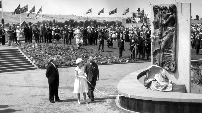 1963 Royal Tour. Queen Elizabeth pulls a cord to unveil a statue at Windsor Green, the civic square at Adelaide's model satellite town, Elizabeth. Standing beside her is chairman of the SA Housing Trust - which planned and built Elizabeth - Mr JP Cartledge. The statue was presented to Elizabeth by the town of Hemel Hempstead, a model satellite town 17 miles from London.