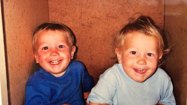 Connor Cockerton (L) and Mitchell Cockerton (R) hiding in the cupboard with a bowl of chocolate cake mix they stole from the kitchen, the cheeky pair were found by their mum Lisa Cockerton just before she snapped this pic.