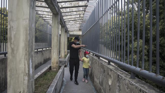 Tourists visit the beast area at Wuhan Zoo. Picture: Getty