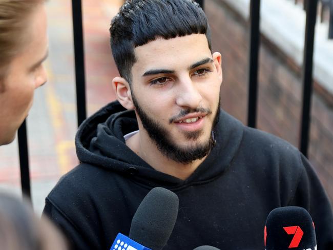 SYDNEY, AUSTRALIA - NewsWire Photos APRIL 18, 2024: Dani Mansour pictured talking to media after leaving Blacktown police station after making bail. A 19-year-old man was arrested and taken to Blacktown Police Station where he was charged with riot, affray and destroy/damage property during public disorder. Strike Force Dribs was set up to investigate the violent incidents outside a Wakeley church on Monday 15 April 2024, following the alleged attack of a 53-year-old religious leader.Picture: NCA NewsWire / Damian Shaw