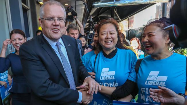 Scott Morrison with Reid candidate Fiona Martin, in navy, and Liberal supporters in Sydney’s Burwood yesterday. Picture: Alex Coppel