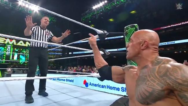 The Rock threatens the ref at WrestleMania. Photo: X.