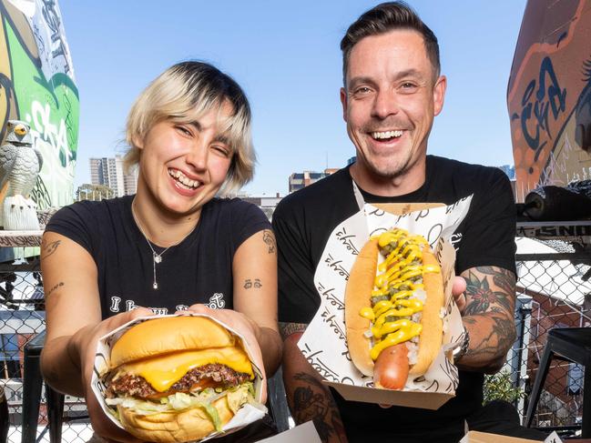 Katie Fennelly and Jimmy Hurlston infant of EaseyÃs Iconic train carriages. AO attendees will be able to eat burgers from Collingwood institution Easey's while court side during Opening Week, and the main tournament. Picture: Jason Edwards