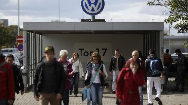 People leave the Volkswagen factory at Gate 17.