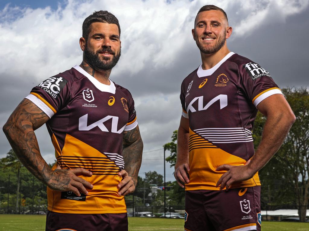 Broncos captain Adam Reynolds (left) and teammate Kurt Capewell show off the team’s new jersey for the 2023 NRL season. Picture: Zak Simmonds